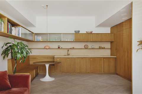 Oak Cabinets, Cupboards, and Banquet Seating Reset a Small East London Flat