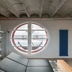 Steel Scaffolding Forms a Bed and Wardrobe in This Small Slovakia Apartment